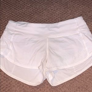 WHITE LULULEMON SHORTS//// size two